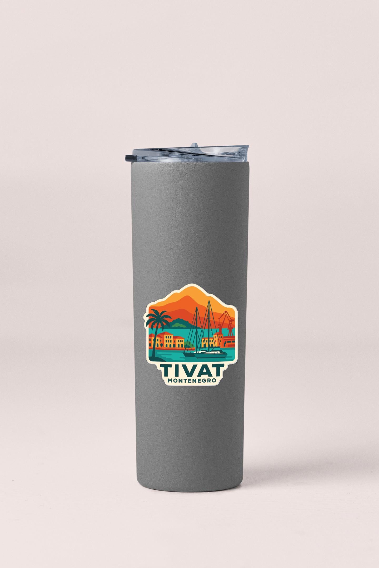 A gray insulated tumbler with a sticker depicting a tropical island and the text "TIVAT MONTENEGRO".