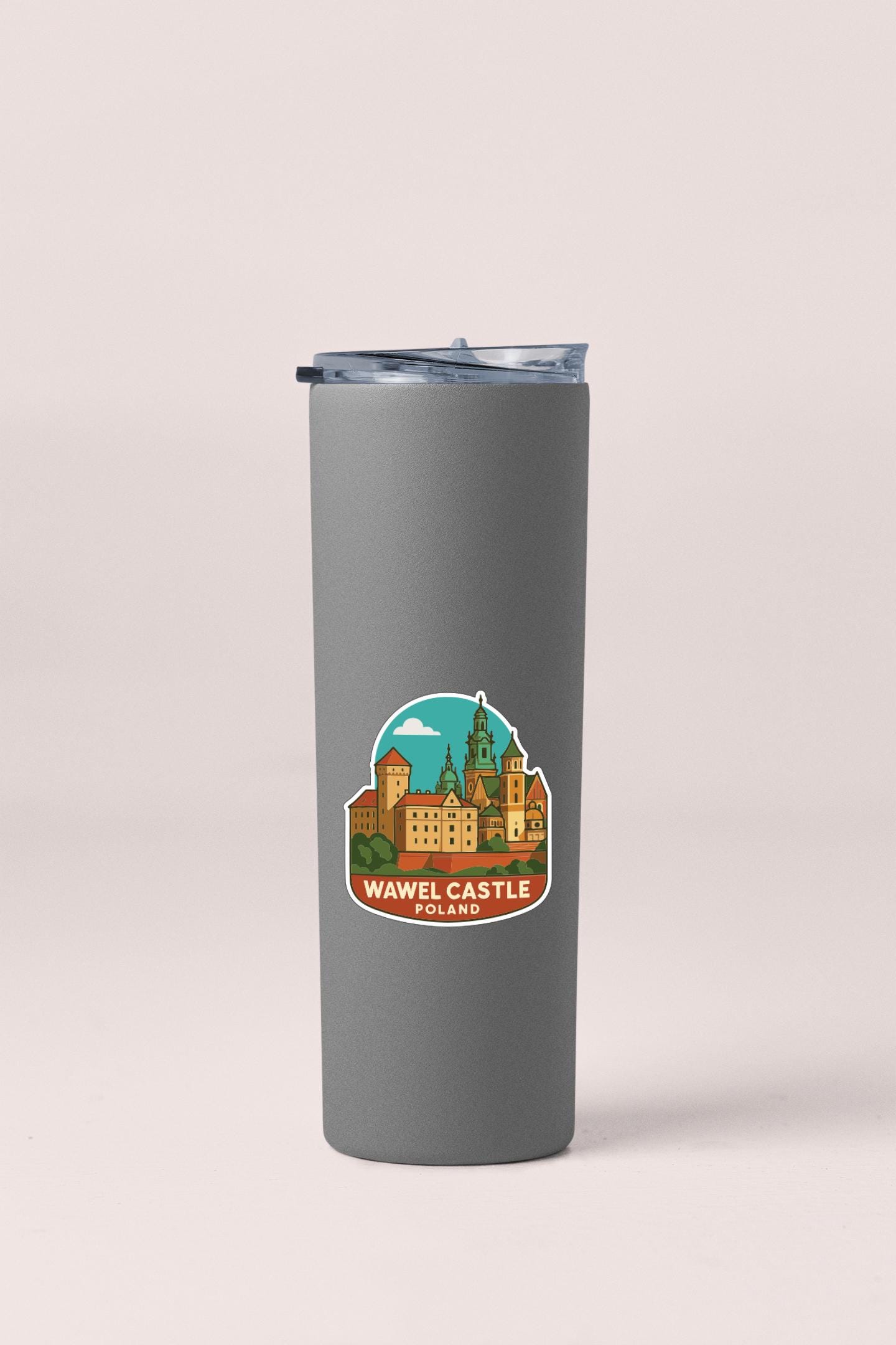 A gray insulated tumbler with a sticker depicting the Wawel Castle in Poland.