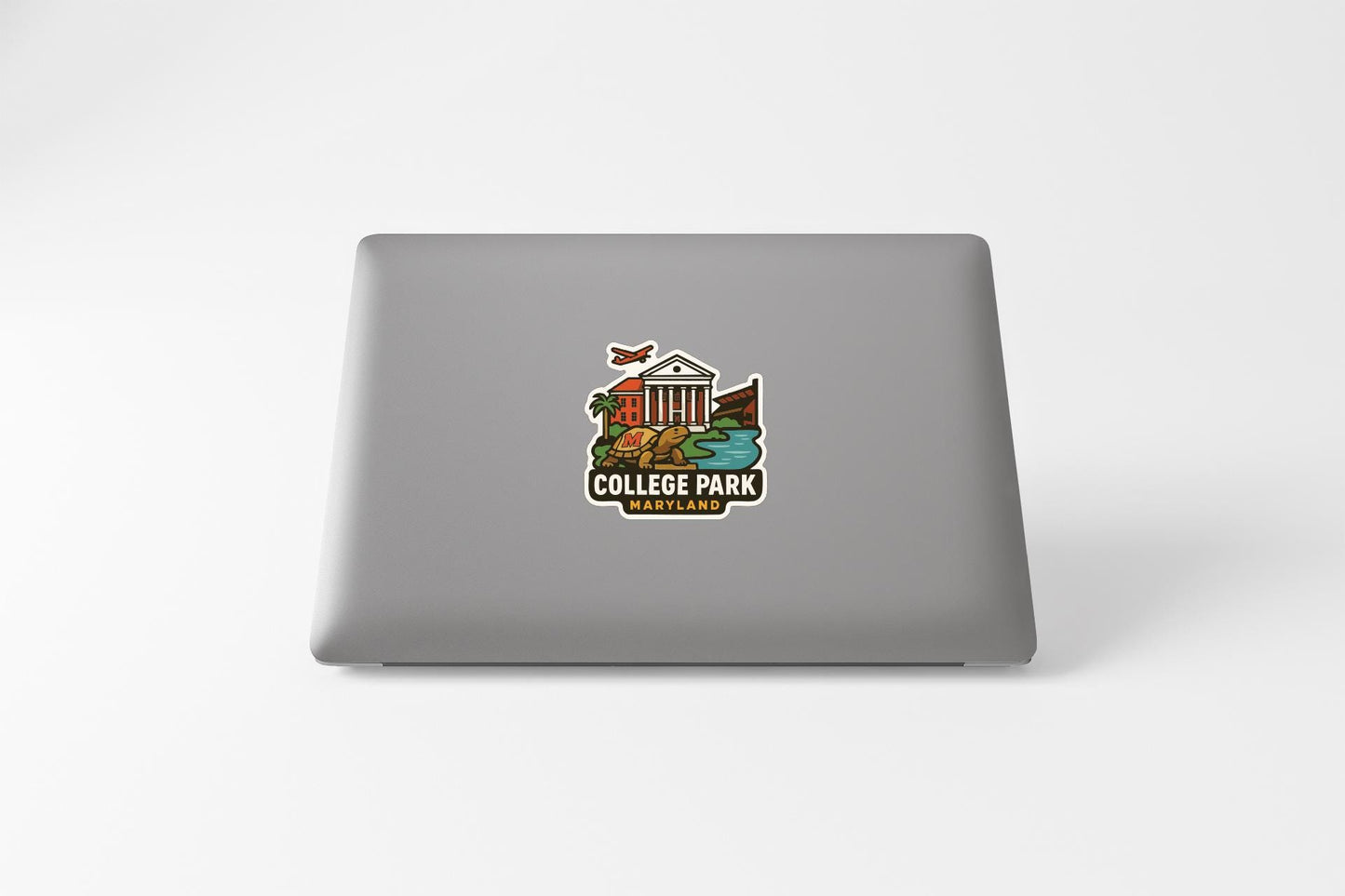 a sticker on the back of a laptop that says "COLLEGE PARK MARYLAND".