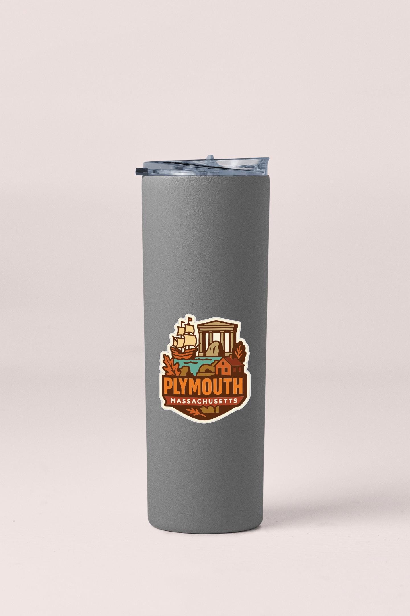 A gray insulated tumbler with a sticker featuring an illustration of a ship and the text "Plymouth, Massachusetts".