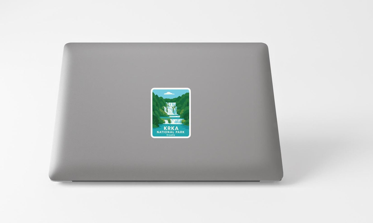 A sticker on the back of a laptop, depicting a waterfall and the text "KRKA NATIONAL PARK".