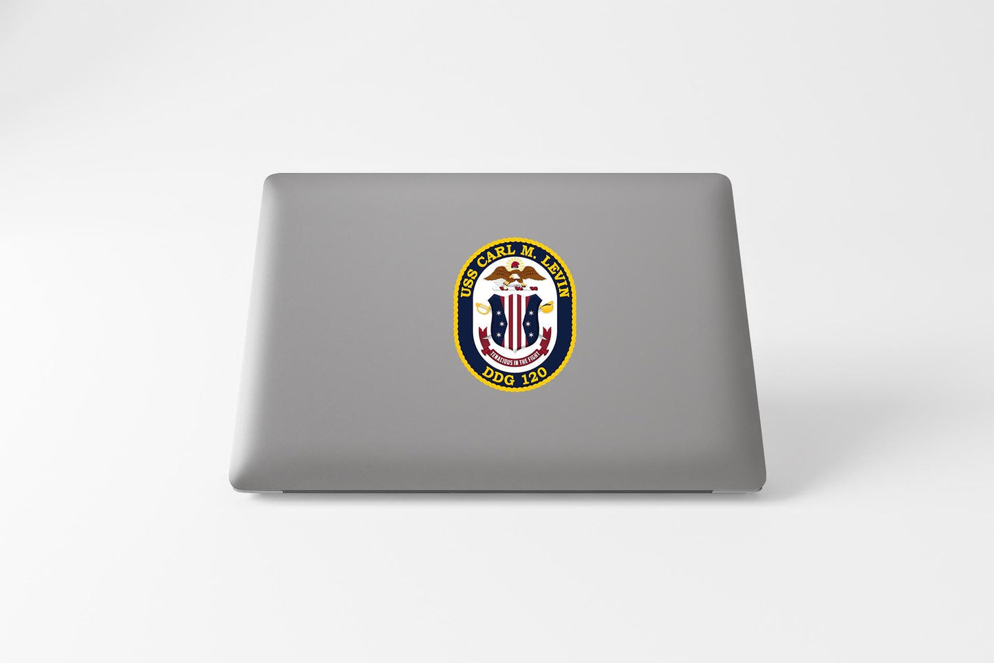 a laptop with a sticker of a coat of arms