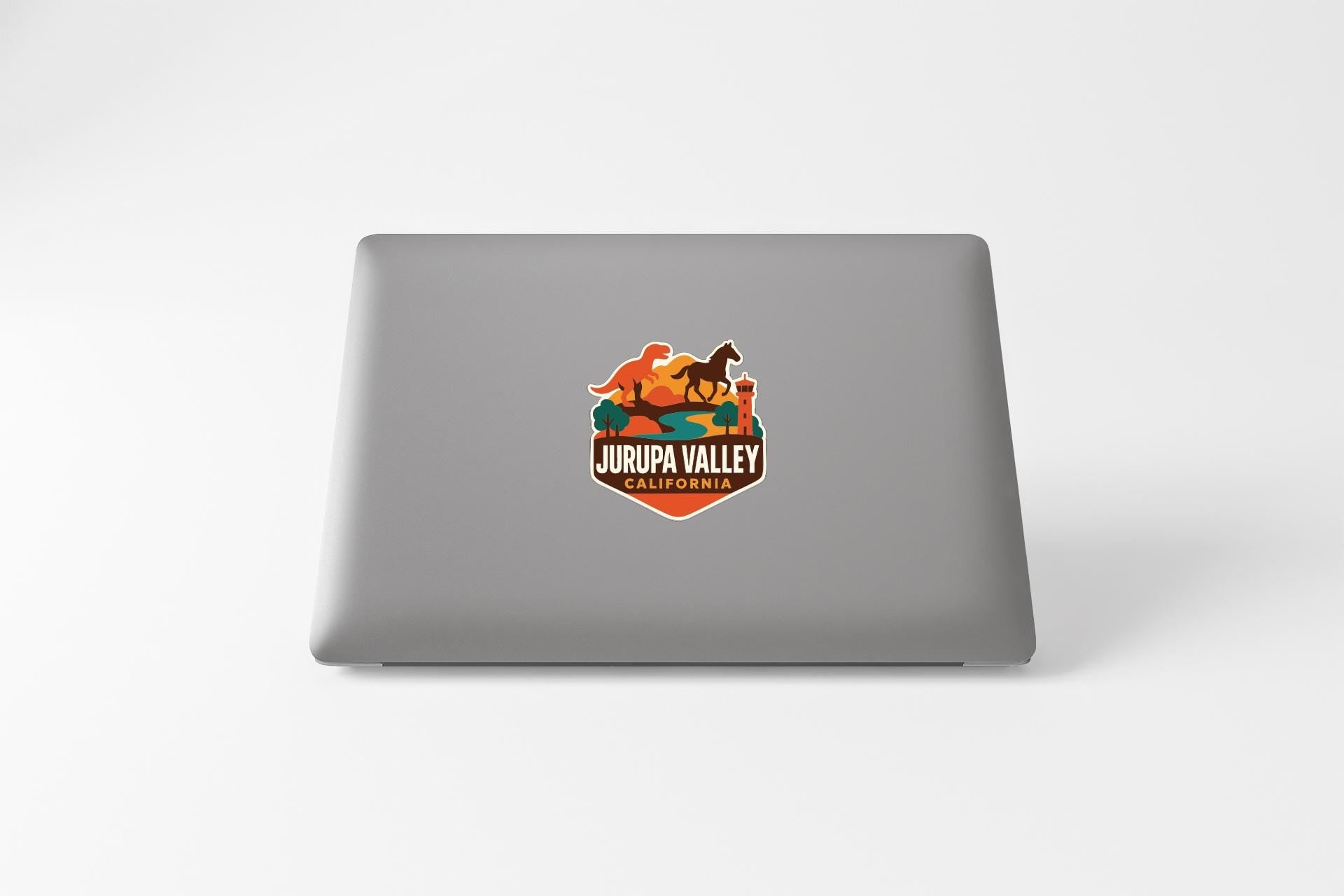 a sticker on the back of a laptop that says "JURIPA VALLEY CALIFORNIA".