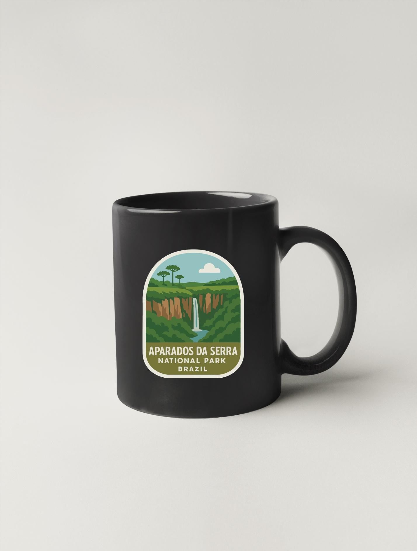 A black coffee mug with a label that says "Aparaisos do Serra National Park, Brazil".