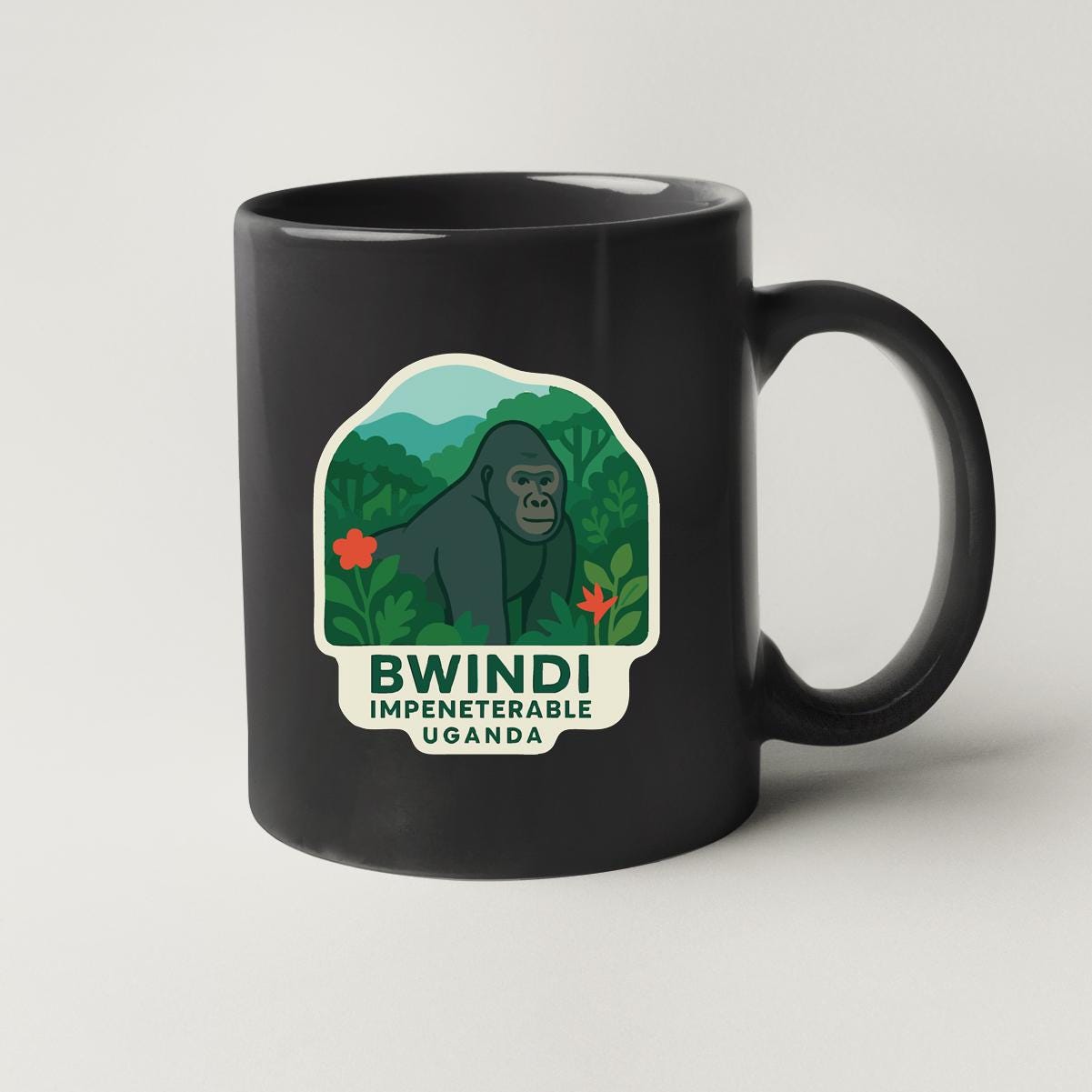 A black coffee mug with a graphic of a gorilla and the text "Bwindi Impenetrable Uganda" printed on it.