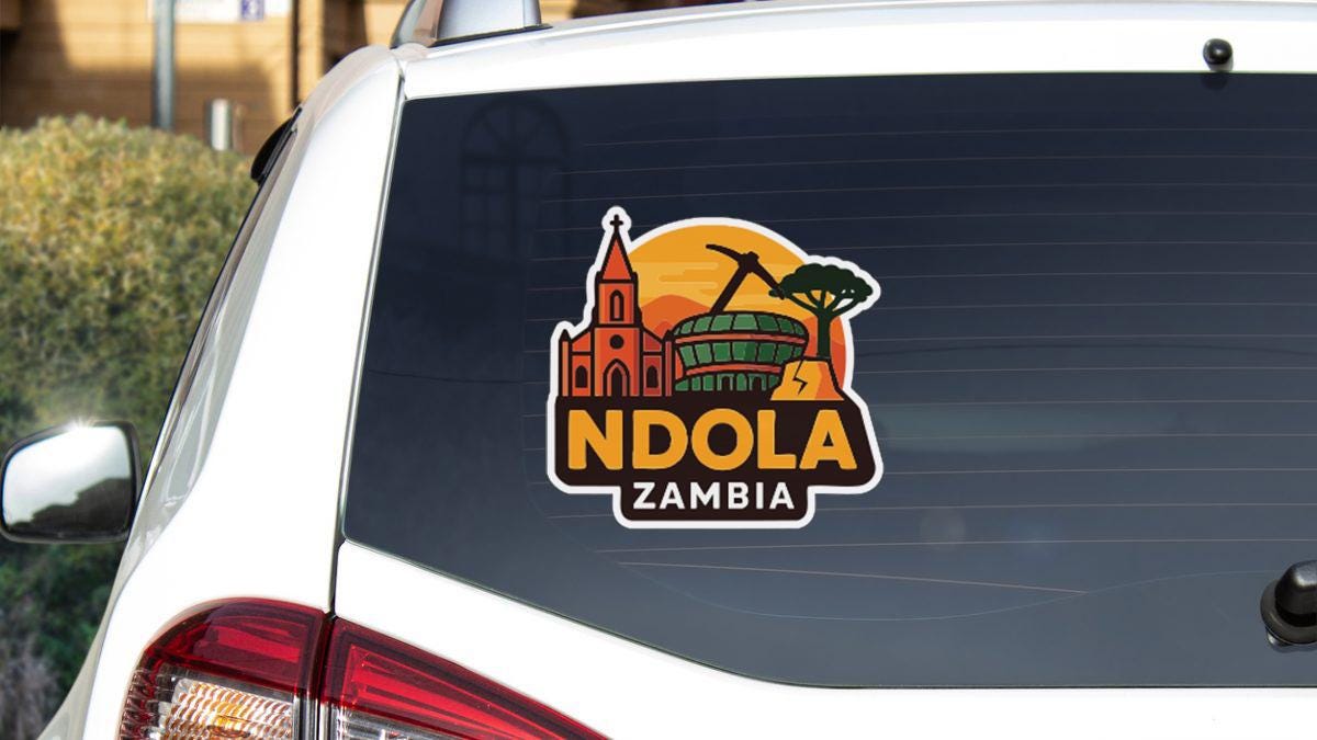 a sticker on the rear window of a vehicle, depicting a landmark in Zambia.