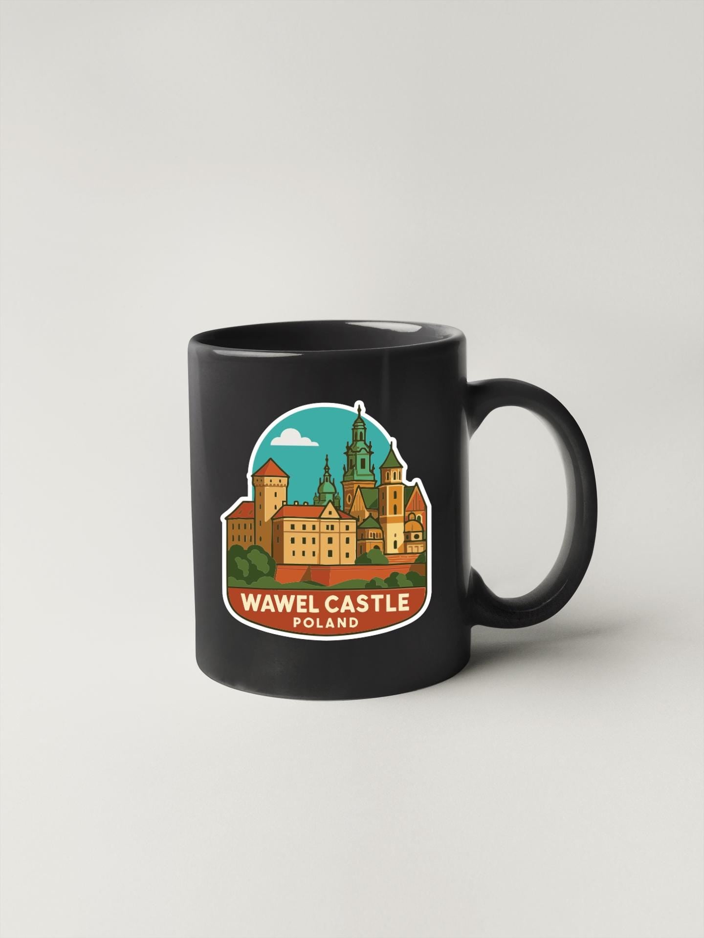 A black coffee mug with a colorful illustration of the Wawel Castle in Poland on it.