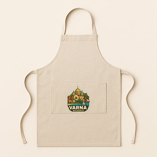 A beige apricot with a graphic design on the front pocket, featuring a cityscape or landmark.