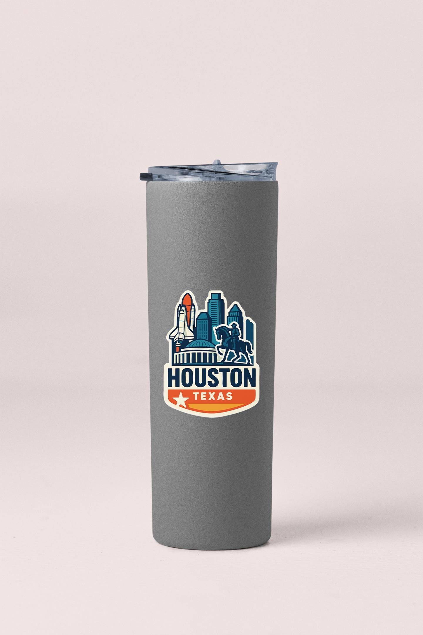 a gray tumbler cup with a houston sticker on it
