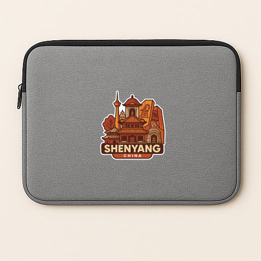a gray laptop sleeve with a sticker of a building and text that says "Shenyang China".