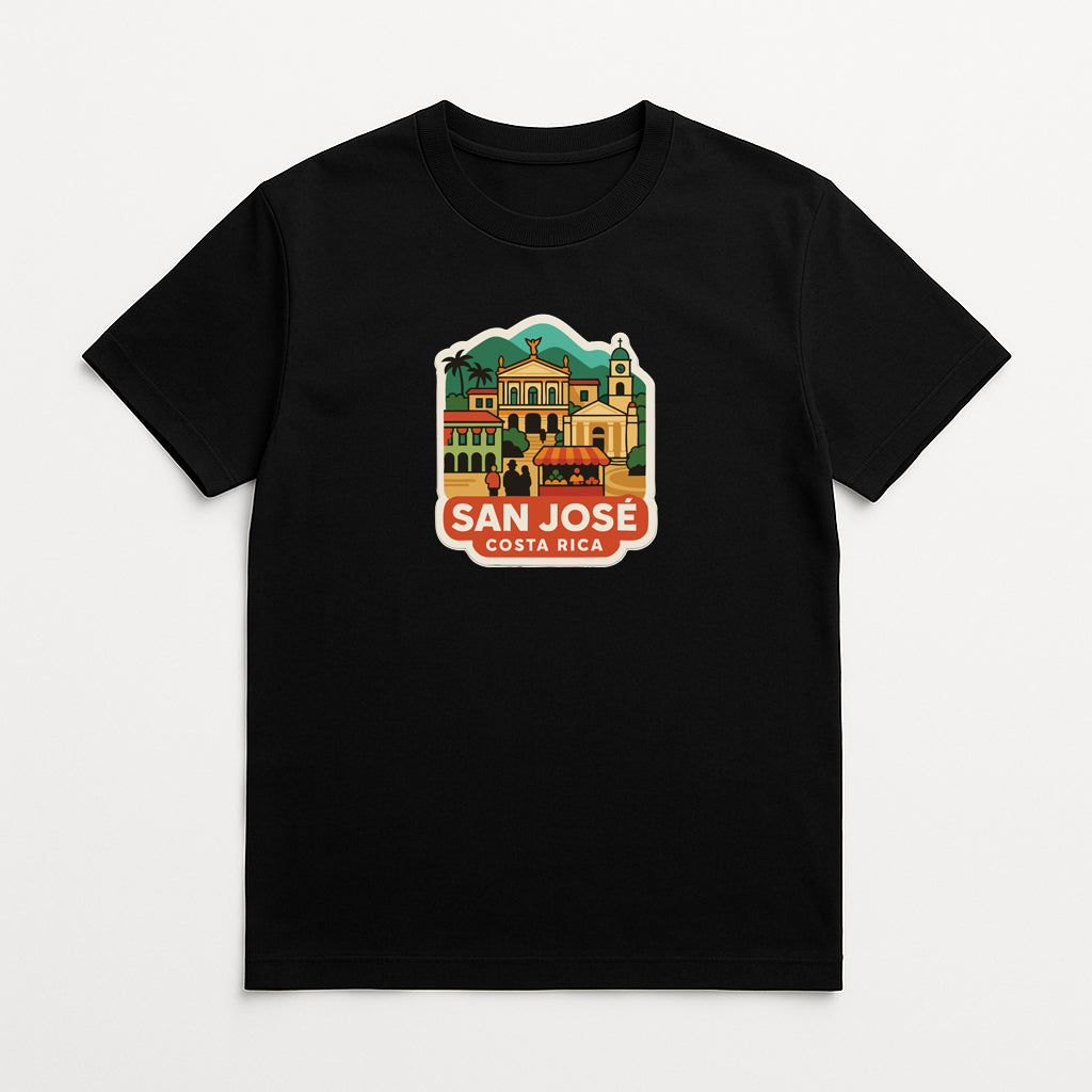 A black t-shirt with a colorful graphic depicting a tropical city scene, including buildings, palm trees, and mountains.