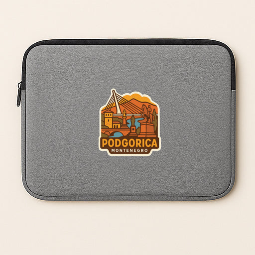A gray laptop sleeve with a sticker depicting the city of Montenegro.