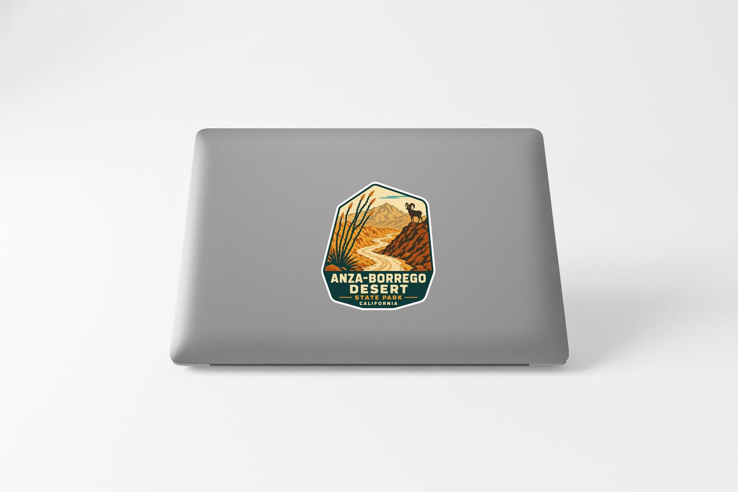 a sticker on a laptop that displays the name of a desert resort, "ANZA-BORREGO DESERT RESORT".