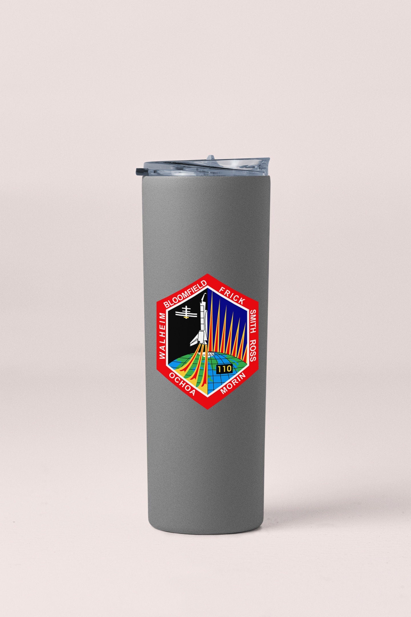a stainless steel tumbler with a picture of an airplane on it