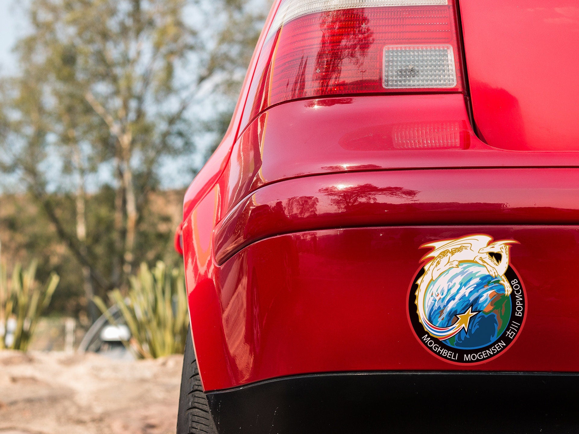 a close up of the rear end of a red car