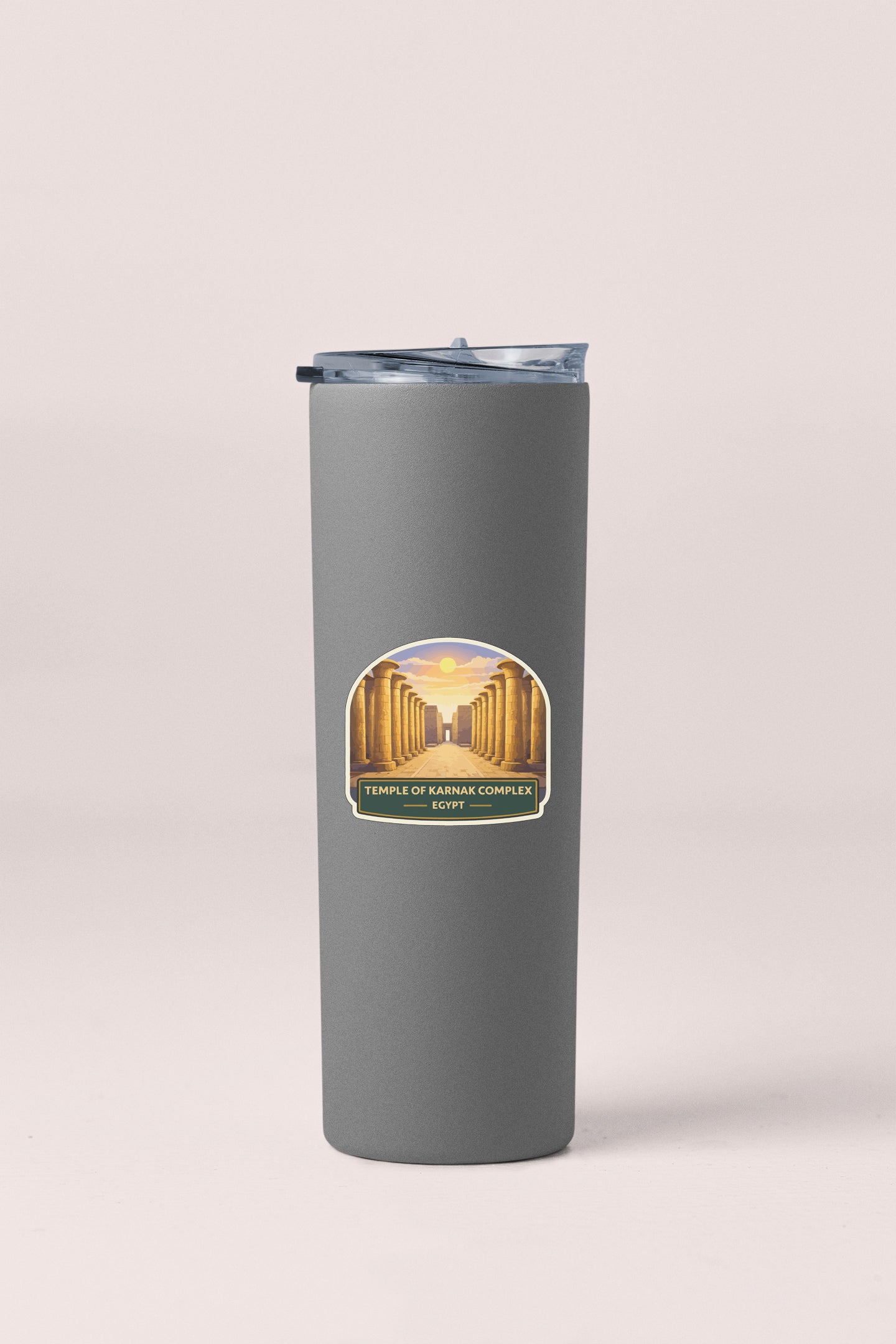 A gray cylindrical container with a lid, featuring a label that reads "TEMPLE OF KARNAK COMPLEX - EGYPT".