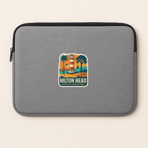 A gray laptop sleeve with a colorful graphic of a lighthouse and palm trees, along with the text "Hilton Head South Carolina".