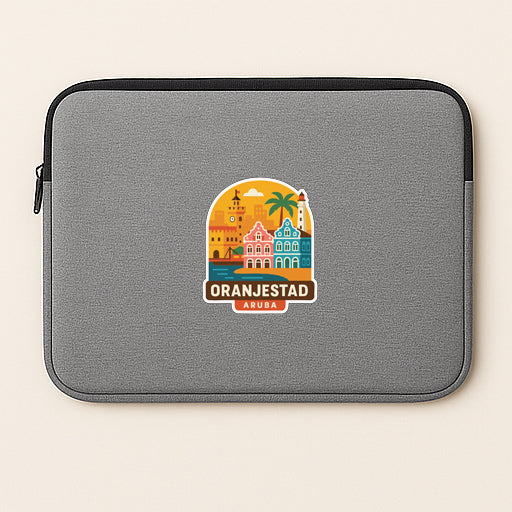 A gray laptop sleeve with a colorful sticker depicting the city of Oranjestad, Aruba.