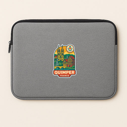 A gray laptop sleeve with a colorful sticker depicting Quimper, France.