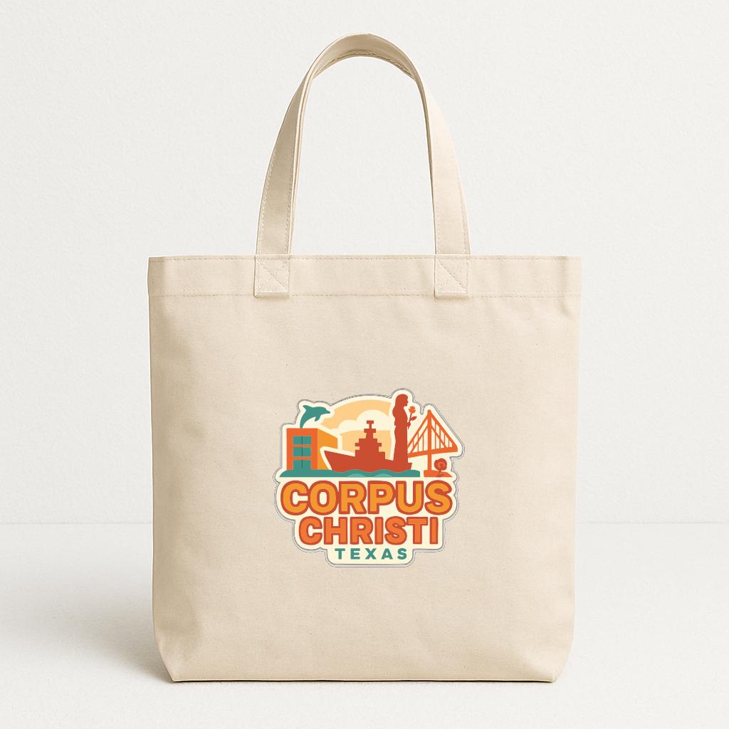 A beige tote bag with a printed logo that says "CORPUS CHRISTI TEXAS".