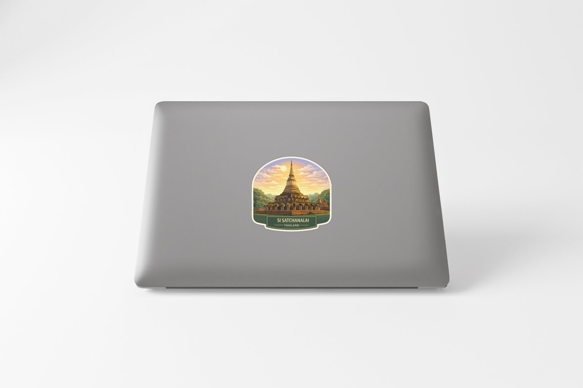 A sticker depicting a temple or pagoda with a colorful sunset in the background.