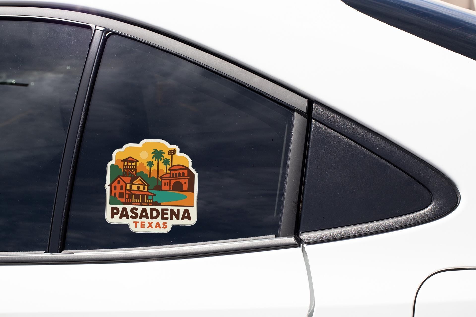 A sticker on the side of a car window, depicting a scenic view of a town or city.