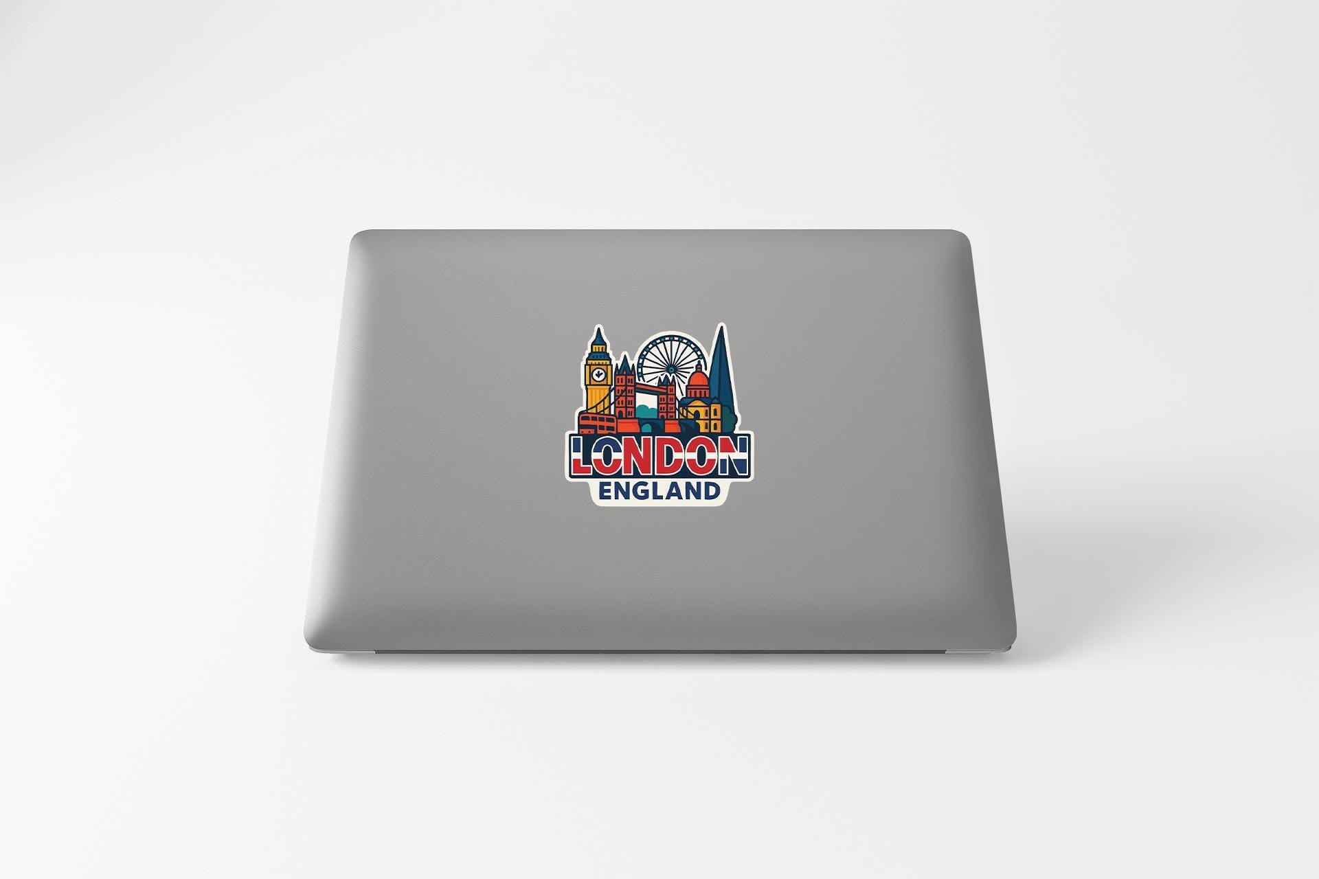 a laptop that has a picture of a city on it