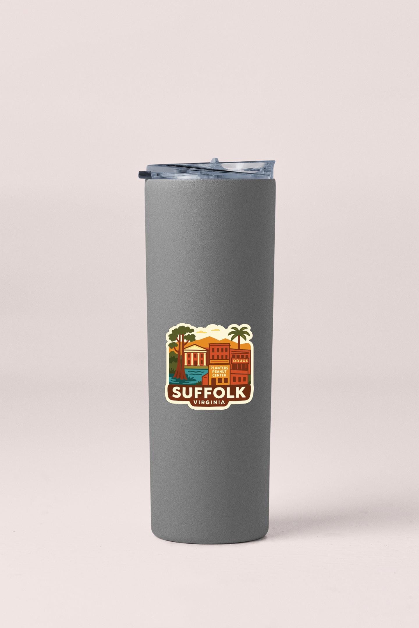 A gray insulated tumbler with a sticker depicting a cityscape and the text "SUFFOLK VIRGINIA".