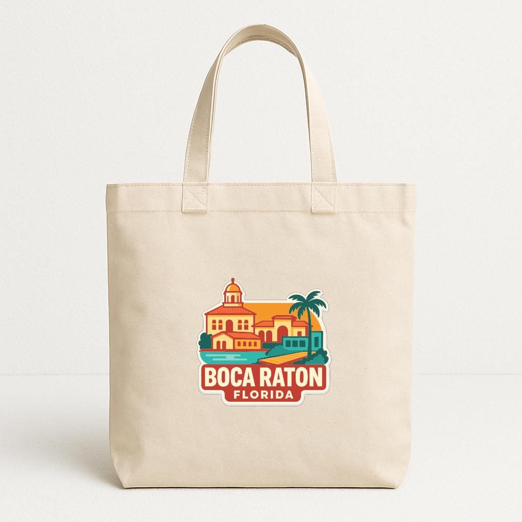 A beige tote bag with a printed design depicting a tropical beach scene, including a building, palm trees, and a surfboard.