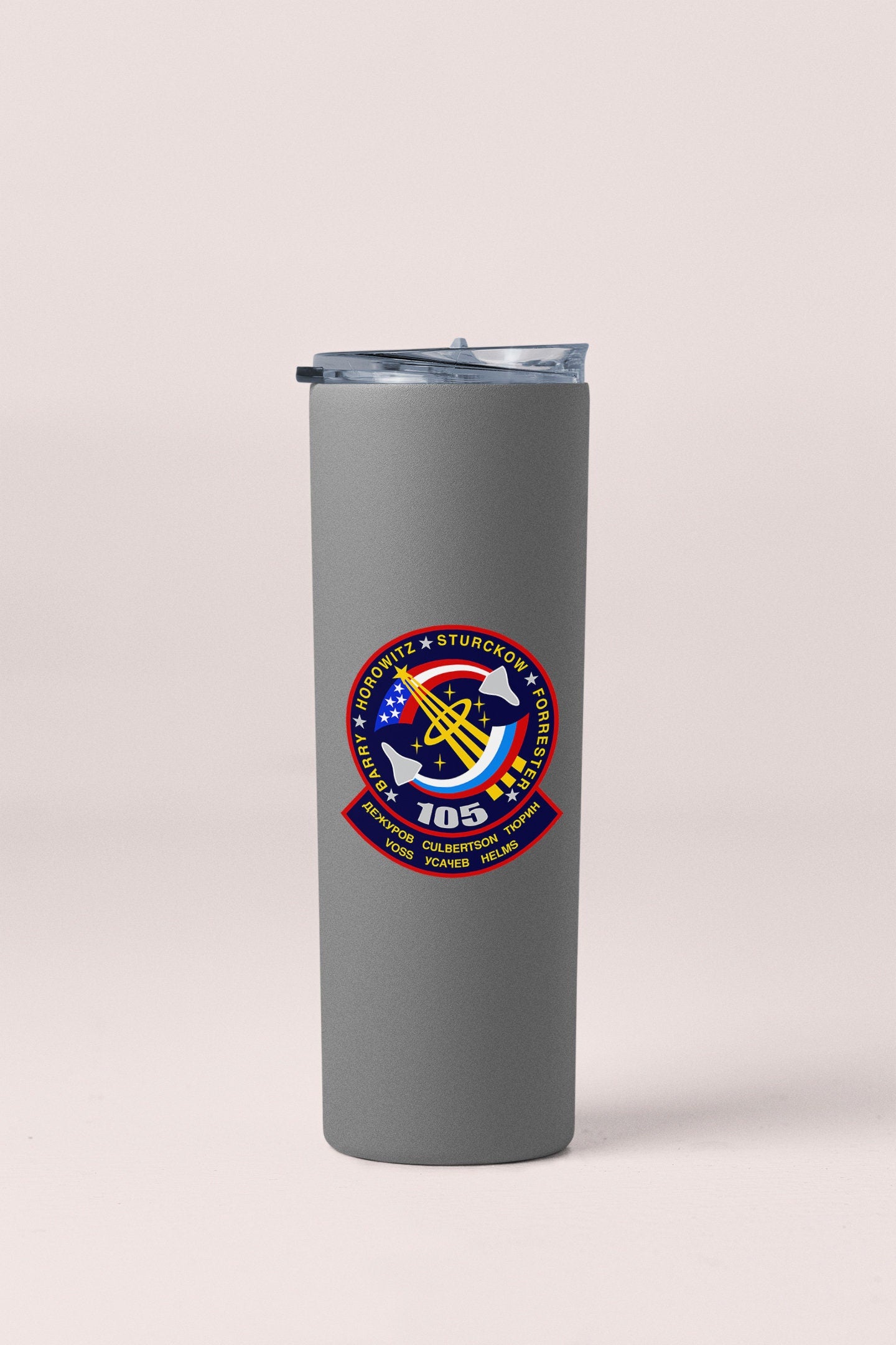 a stainless steel tumbler with a nasa emblem on it