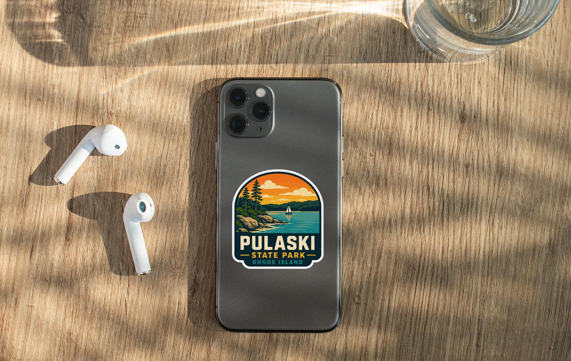 a smartphone with a sticker on it, placed on a wooden surface alongside a pair of white earbuds and a glass of water.