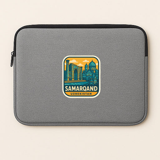 A gray laptop sleeve with a sticker depicting the city of Samarqand, Uzbekistan.