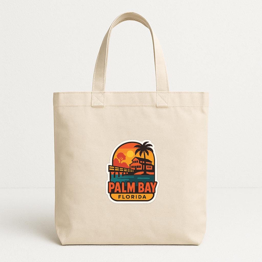 A beige tote bag with a printed logo of Palm Bay, Florida.