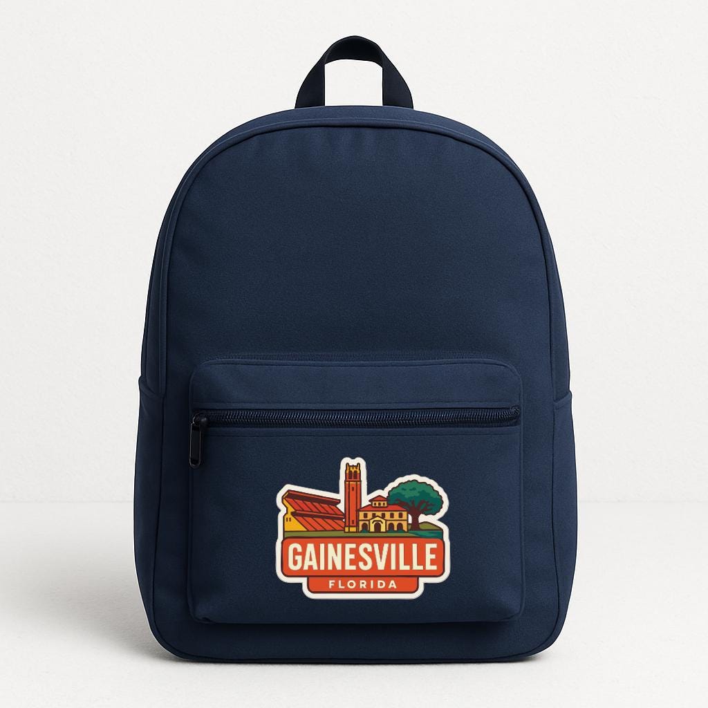 A navy blue backpack with a graphic of Gainesville, Florida on the front pocket.