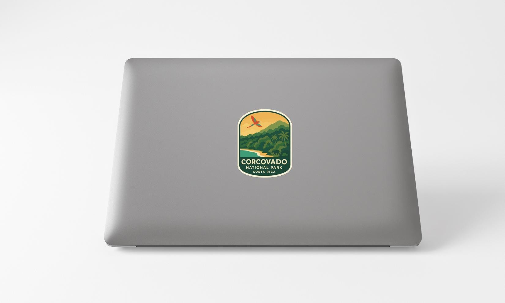 a sticker on the back of a laptop that says "COROVADO COLONIAL PARK COLONIA RICA".