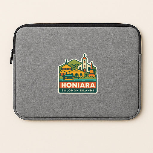 a gray laptop sleeve with a colorful sticker depicting the town of Honiara, Solomon Islands.