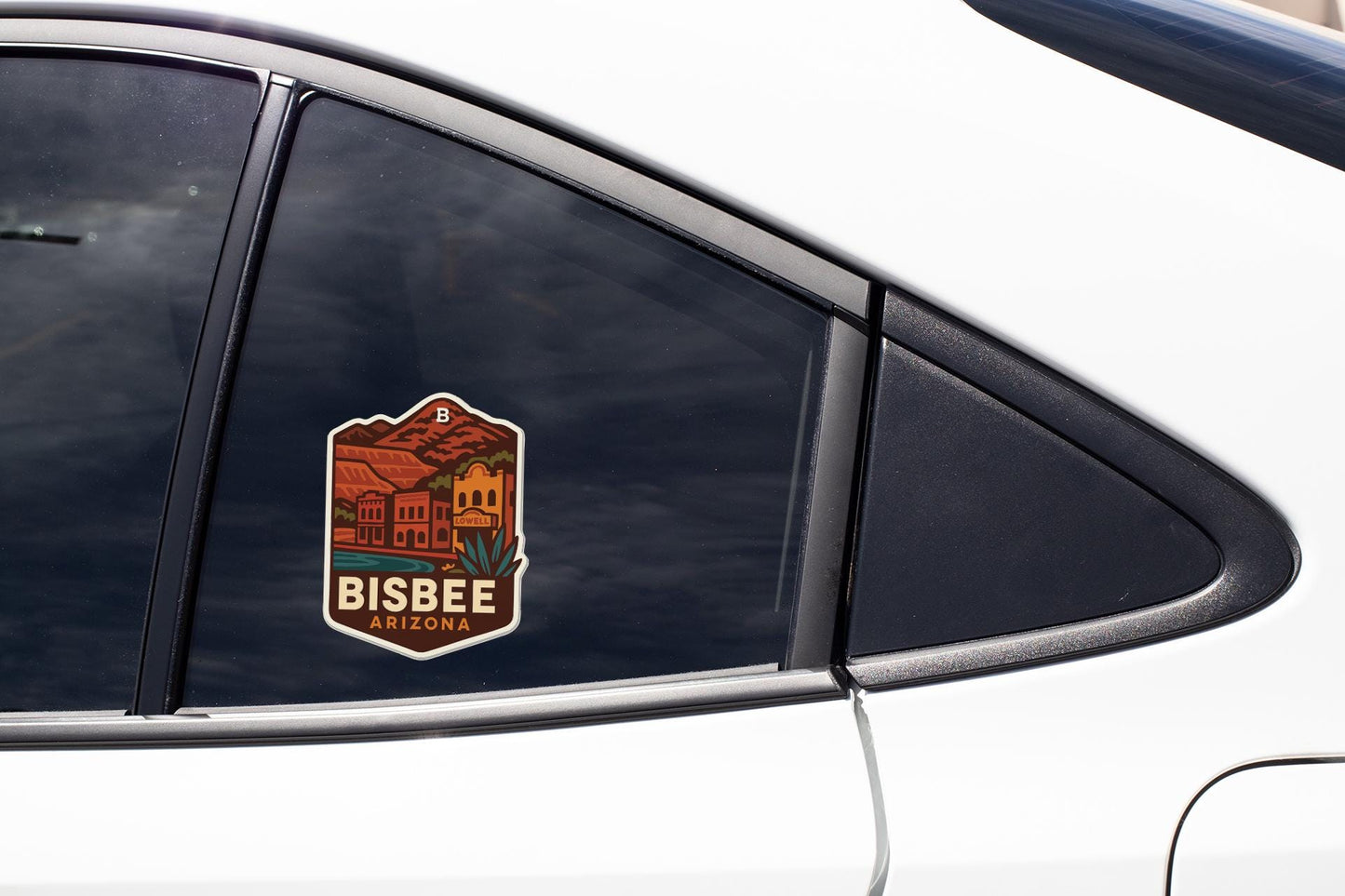 A sticker on the side of a car window that says "BISBEE ARIZONA".