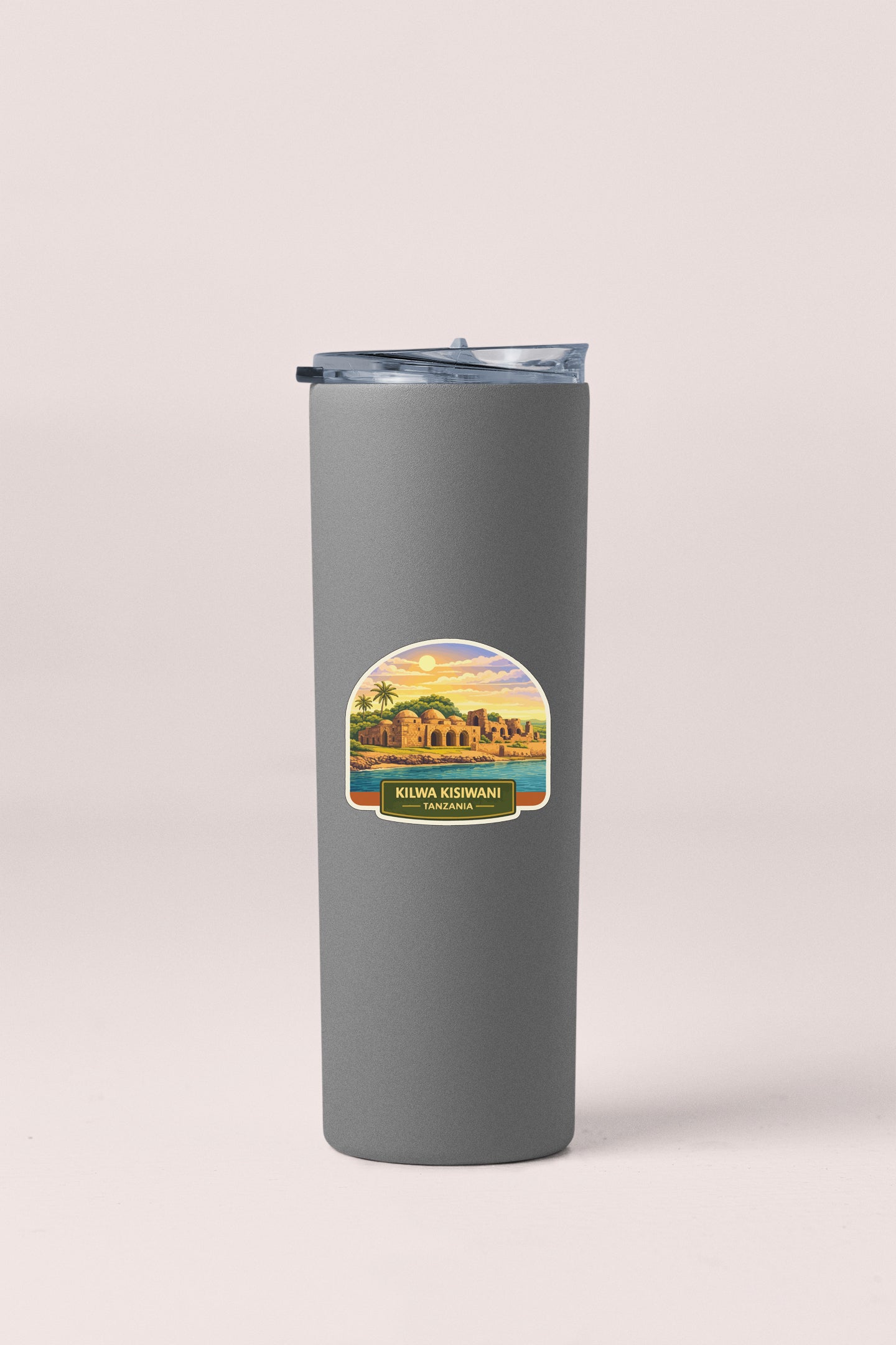 A gray insulated tumbler with a label that says "KILWA KISWANA" and "Tanzania" printed on it.