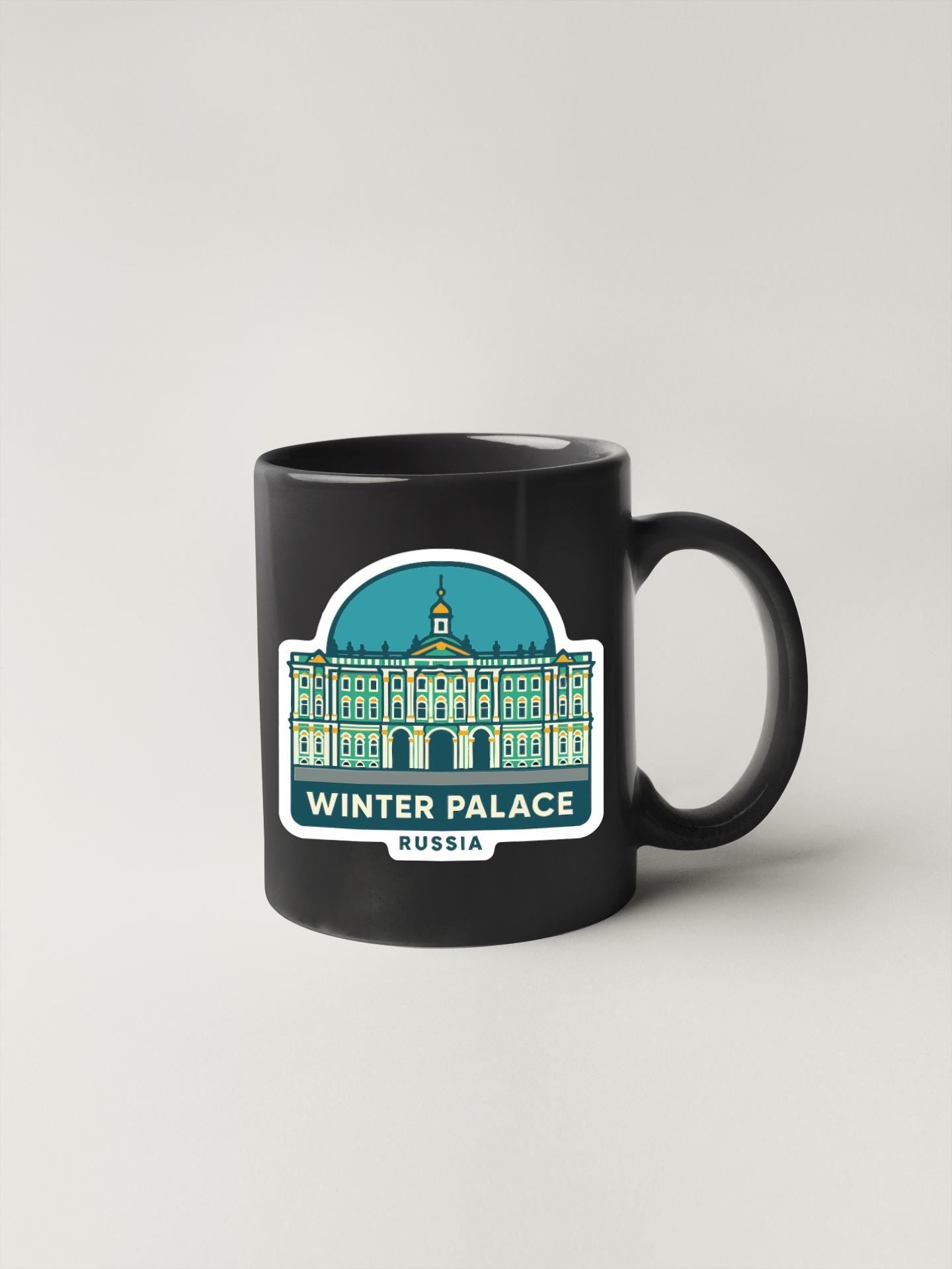 A black coffee mug with a graphic design depicting the Winter Palace in Saint Petersburg, Russia.