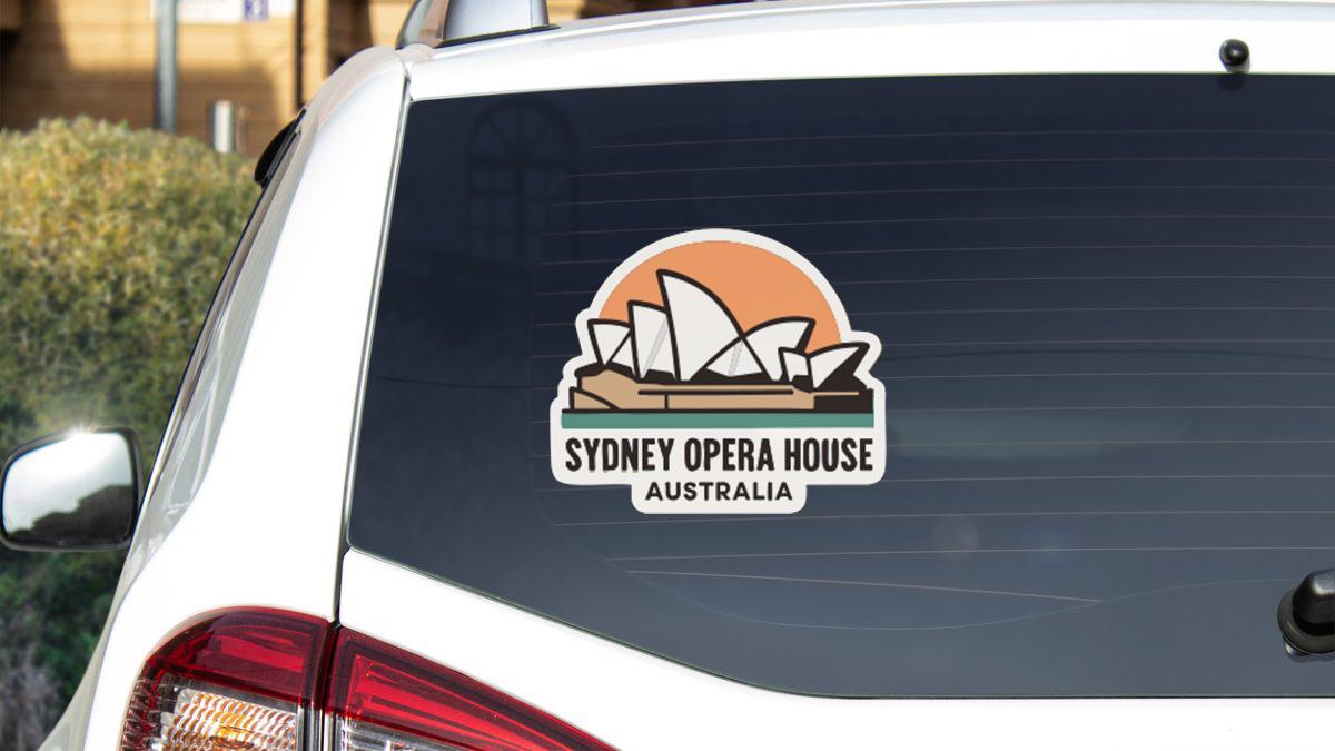 a sticker on the rear window of a car that says "Sydney Opera House Australia".