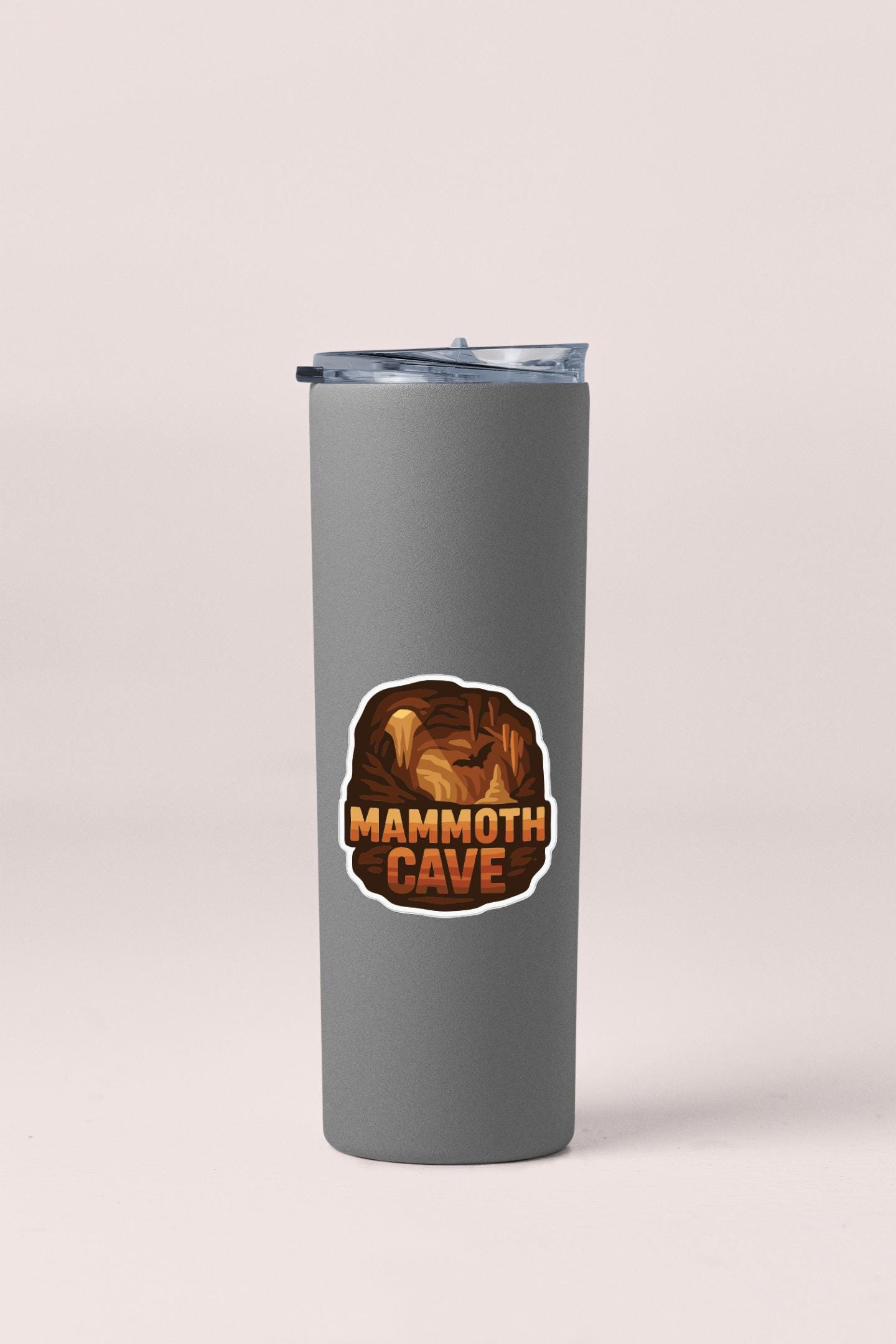 A gray tumbler with a sticker that says "Mammoth Cave".