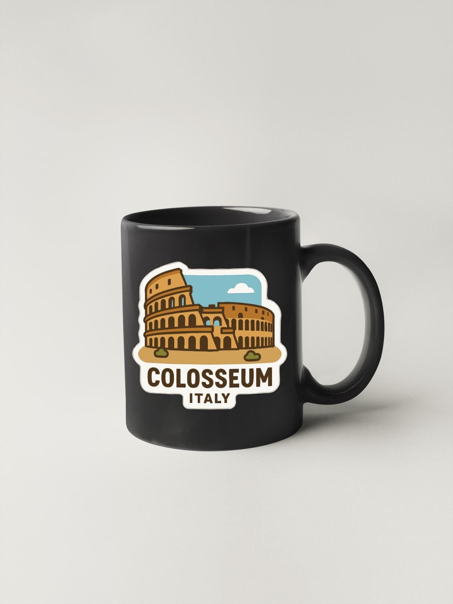 A black coffee mug with a graphic of the Colosseum in Rome, Italy.