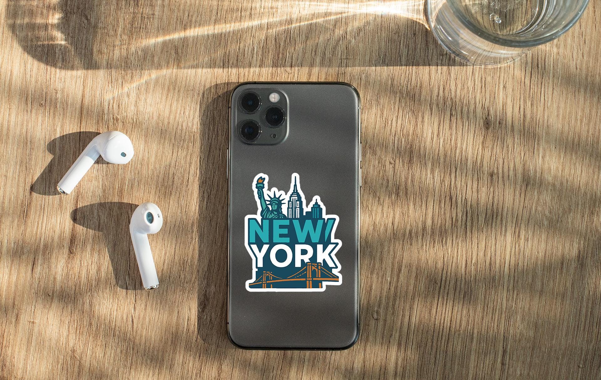 a new york iphone case sitting on top of a wooden table