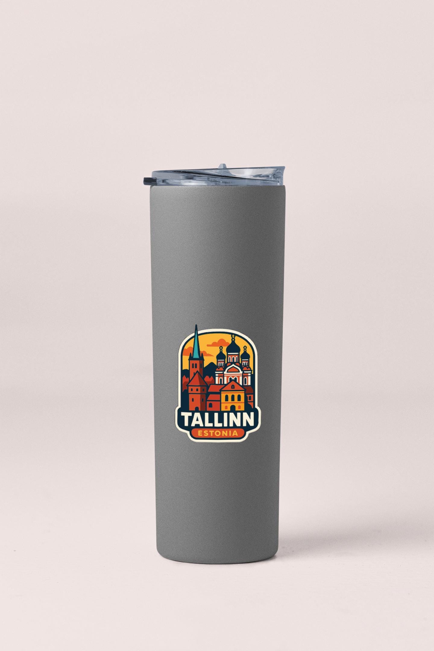 A gray insulated tumbler with a logo depicting the Tallinn, Estonia cityscape.