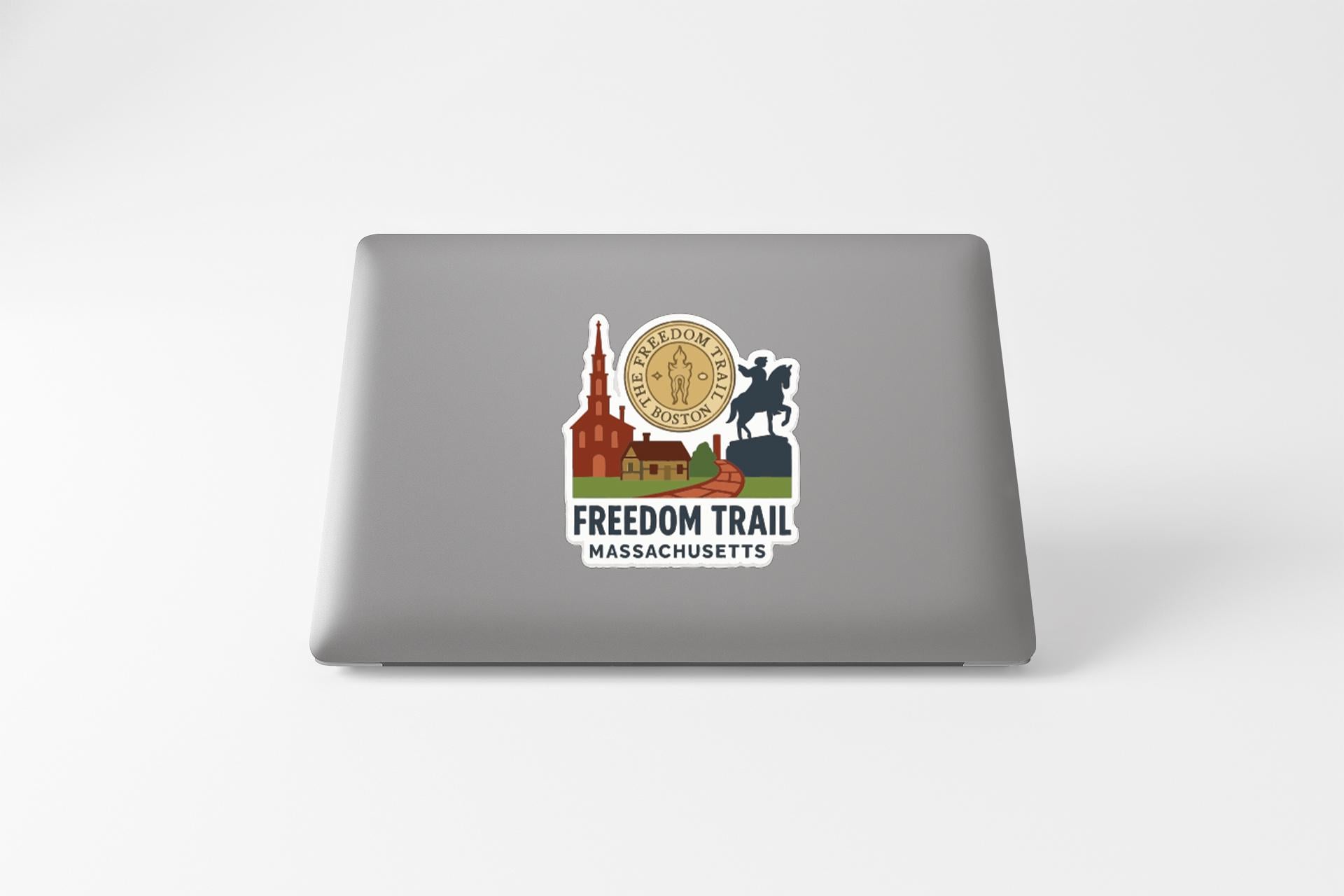 a sticker on a laptop that displays the logo of the Freedom Trail in Massachusetts.