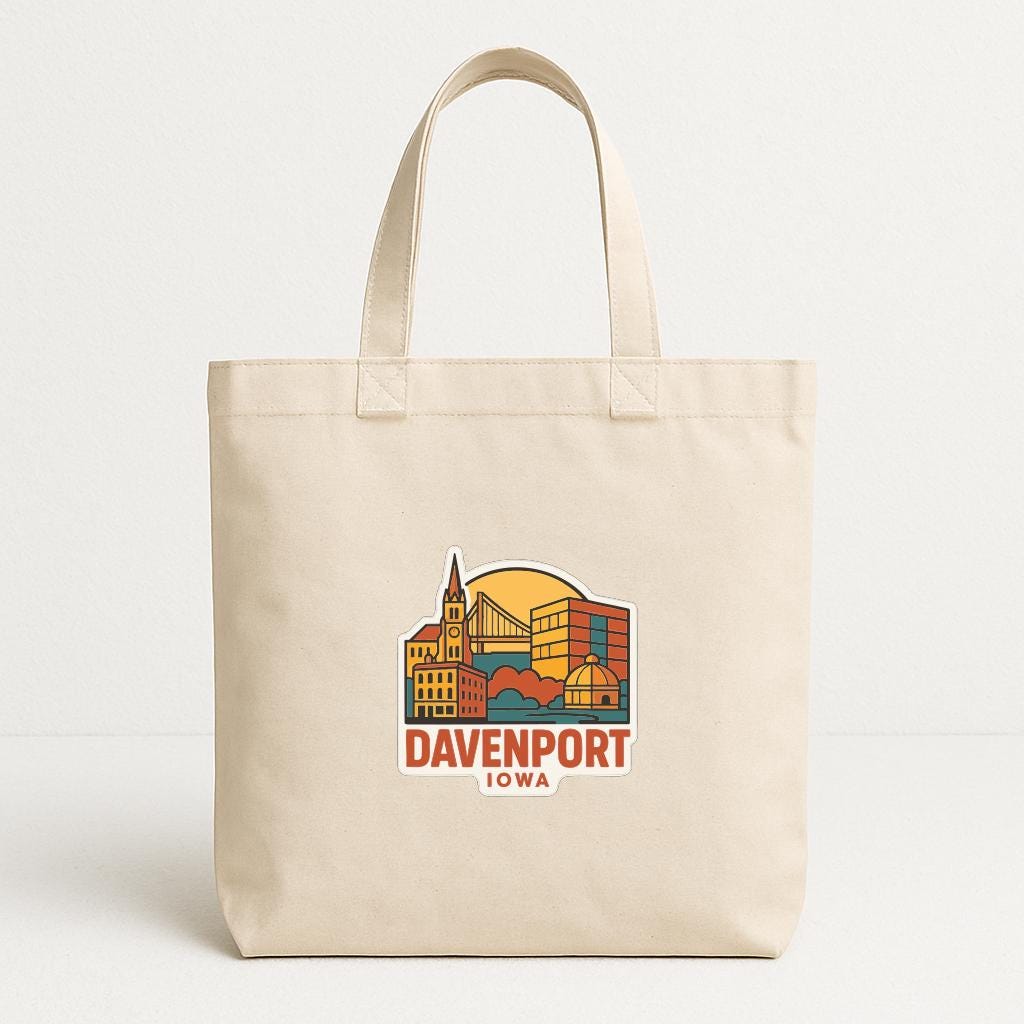 A beige tote bag with a graphic design featuring the city of Davenport, Iowa.