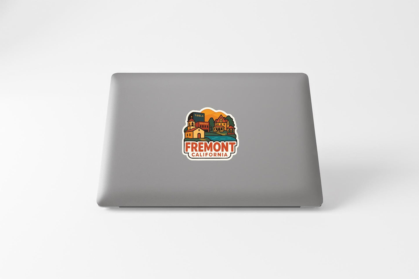 a sticker with a colorful illustration of a building and landscape, along with the text "FREMONT CALIFORNIA".