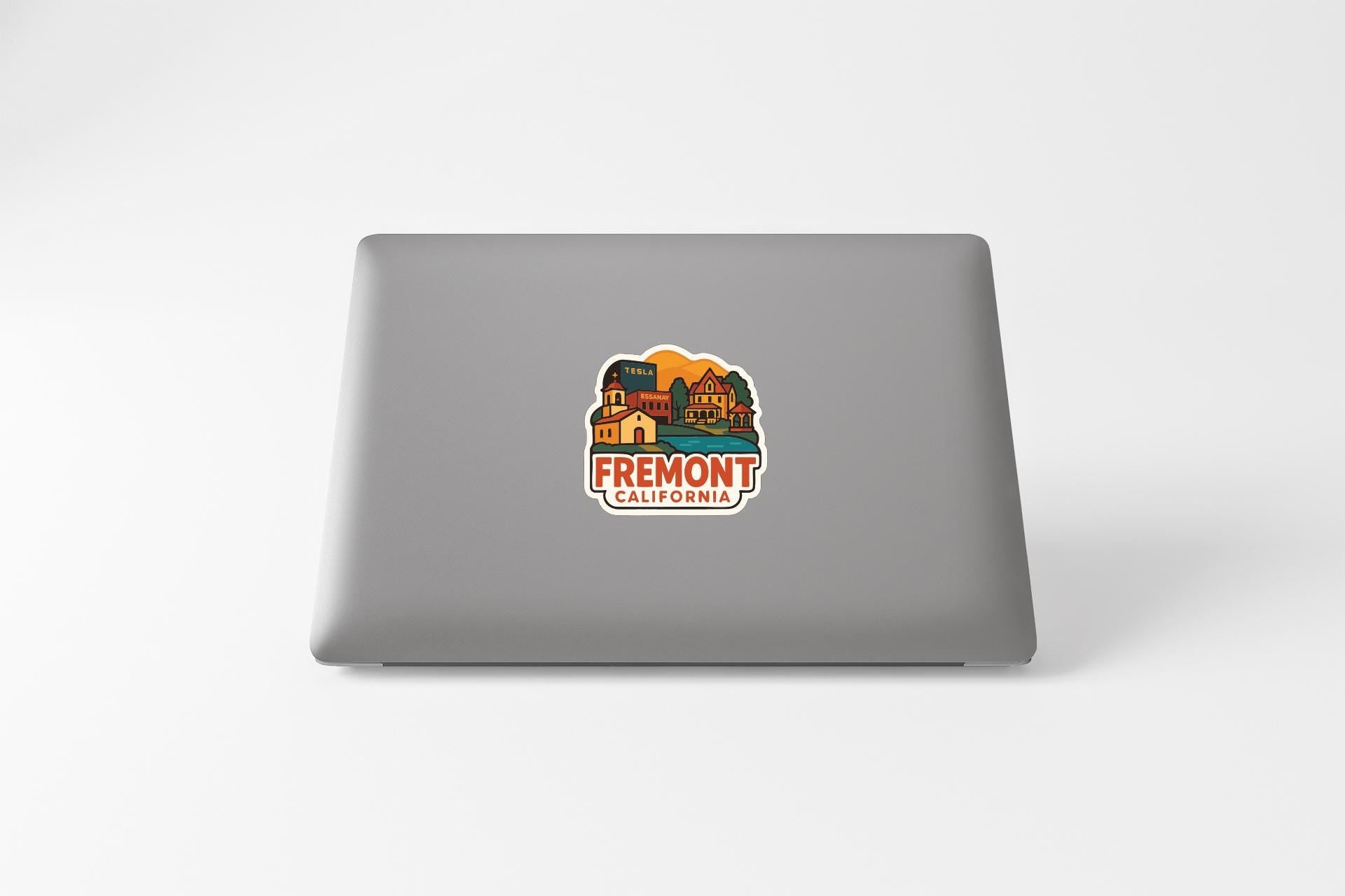 a sticker with a colorful illustration of a building and landscape, along with the text "FREMONT CALIFORNIA".