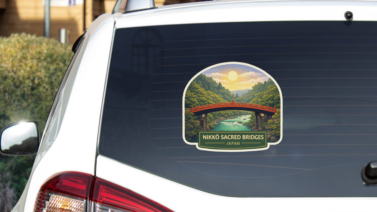 A sticker on the rear window of a car depicting the Nikko Sacred Bridges in Japan.