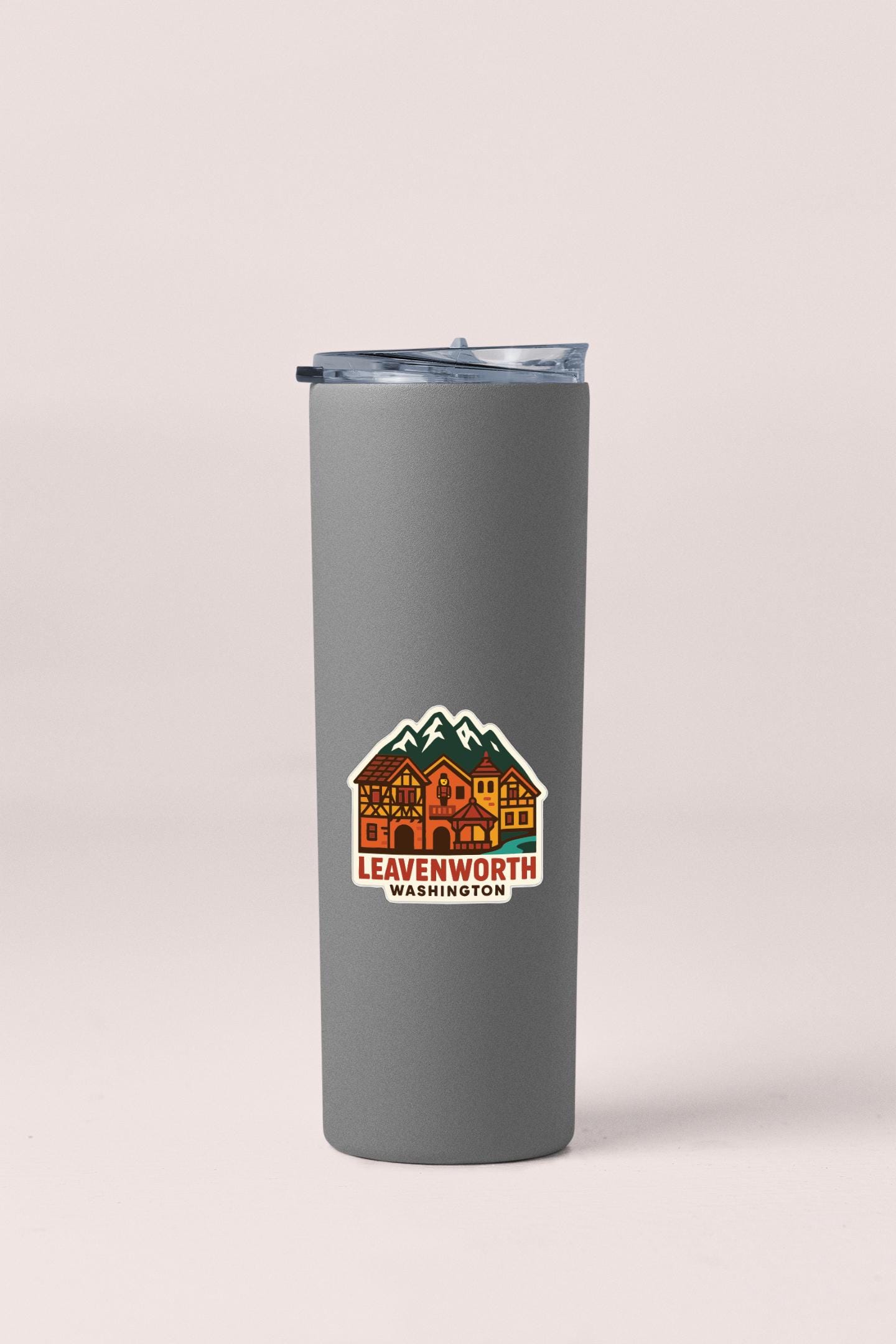 A gray insulated tumbler with a printed logo on it.